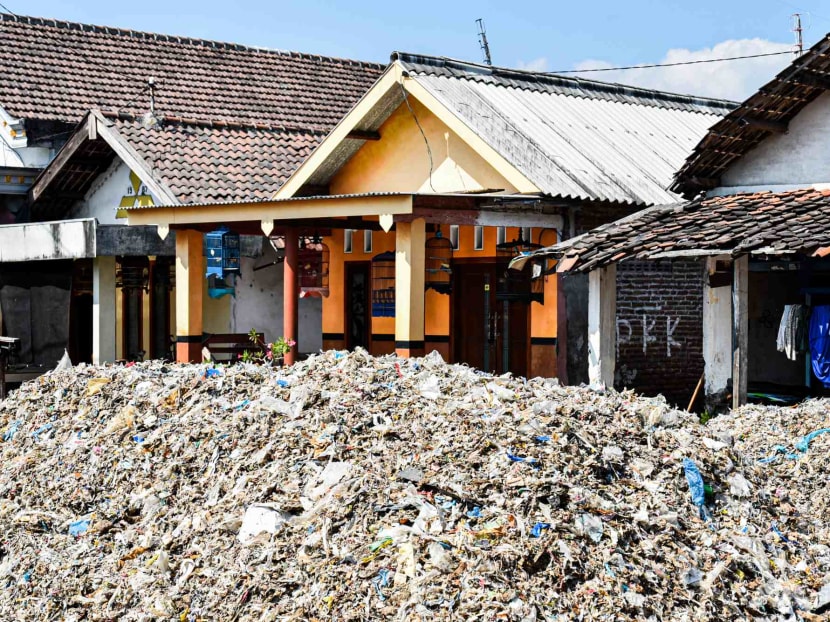 The Indonesian village being buried by the developed world&rsquo;s waste