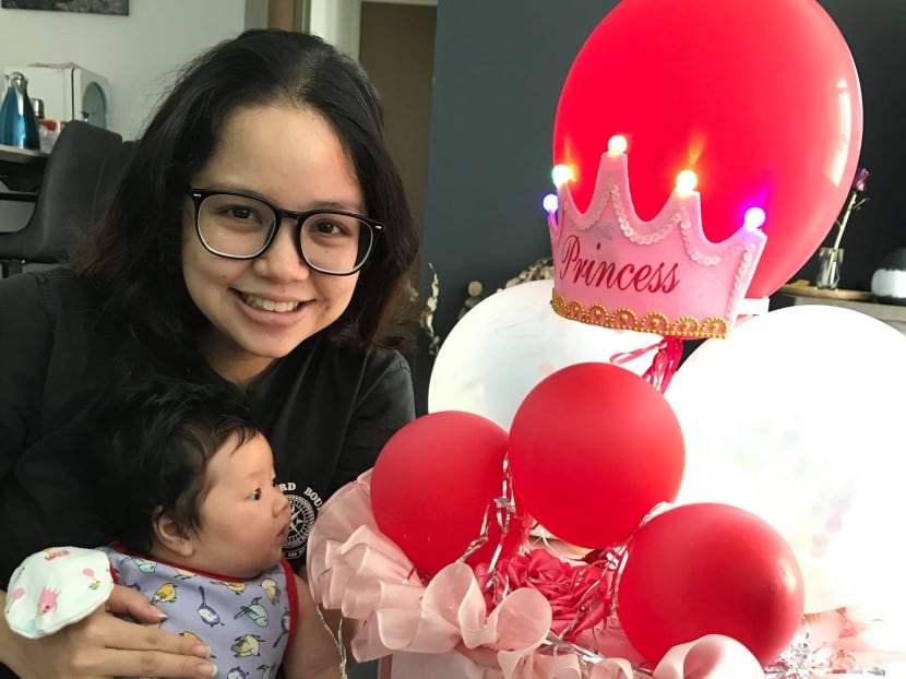 The author, seen here with her baby Fayth, says that she wants to be more than a mother.