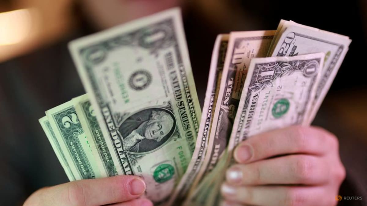 Dollar holds firm at nearly two-week high as Middle East hostilities lift oil