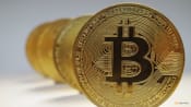 Bitcoin tops $100,000 on trade deal optimism