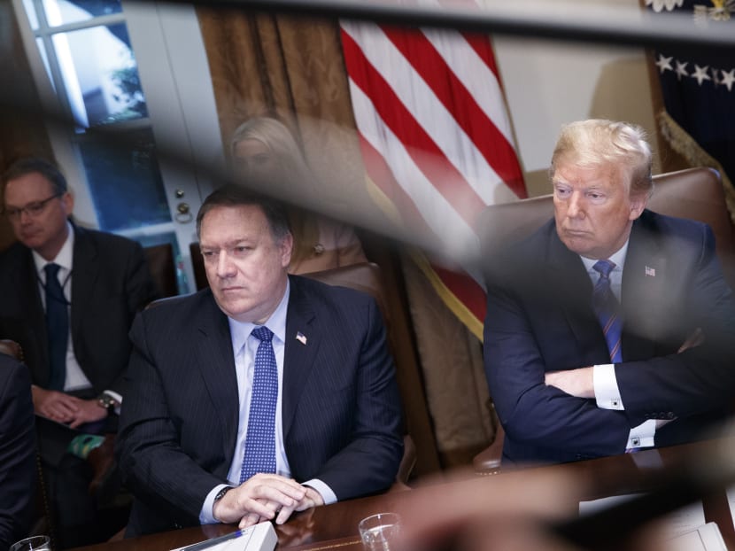 US President Donald Trump (right) is facing uproar over his failure to confront Russian leader Vladimir Putin over Russia's 2016 US election meddling.