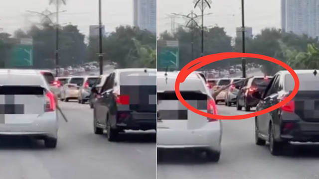 新山EDL发生公路纠纷 一人行驶中持木棍指向另一方