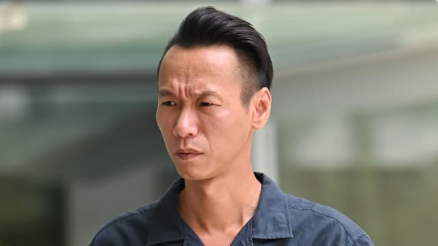 路上见司机用手机 男子路中央停车理论被判入狱九天