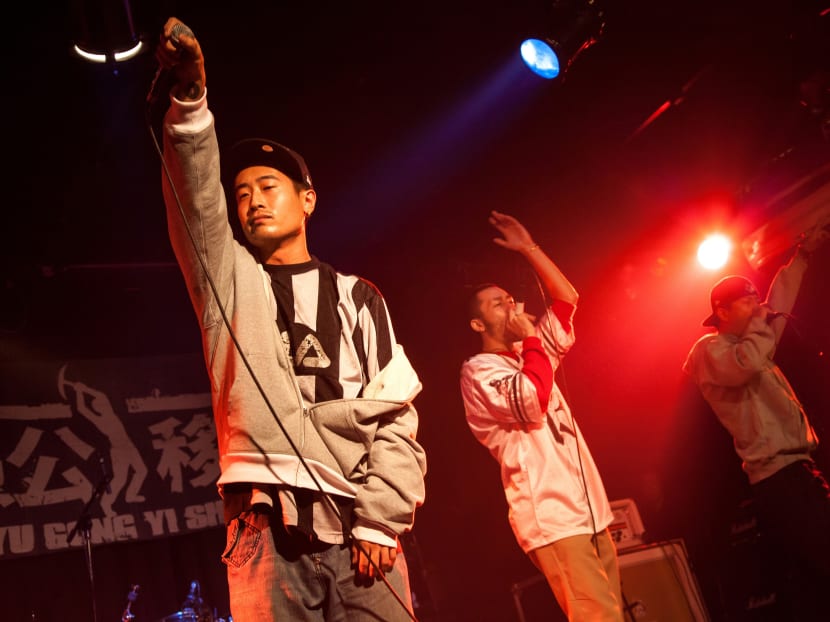This picture taken on September 17, 2010 shows three members of rap music band IN3,  Chen Haoran (left), Jia Wei (centre) and Meng Guodong performing in Yugongyishan livehouse in Beijing. Photo: AFP