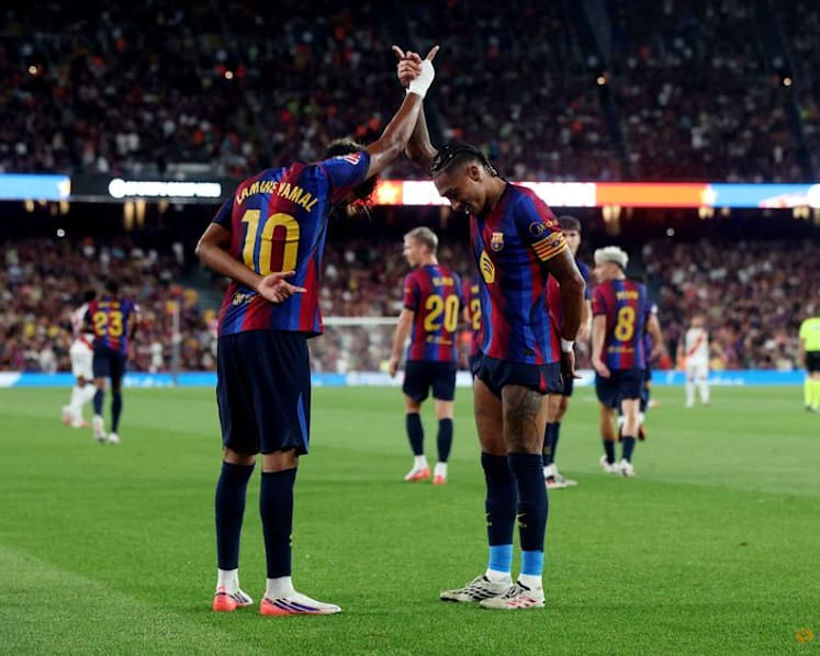 Raphinha and Lamine doubles lift Barcelona past Rayo Vallecano