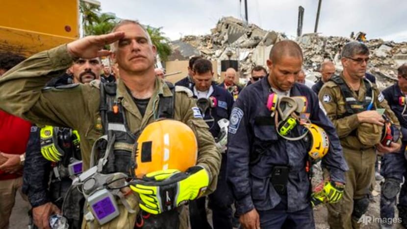 Recovery workers vow not to let up in Florida condo collapse; death toll rises to 64