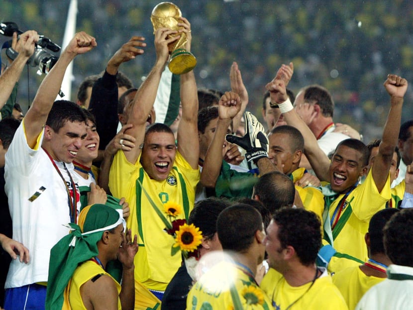 Brazil’s Ronaldo and team-mates celebrating their World Cup win in 2002. Brazil need to win the World Cup more than ever as it would give the nation respite for the money spent on hosting the tournament instead of improving the vast country’s social services and infrastructure. PHOTO: REUTERS