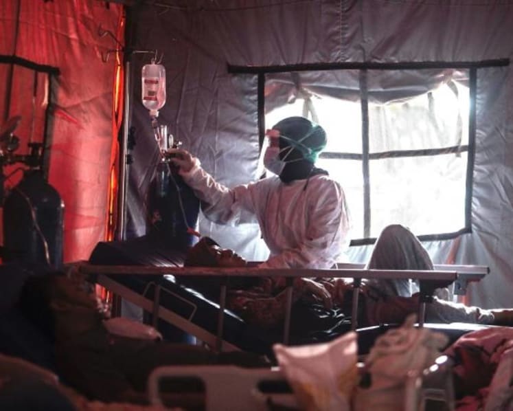 Record high of more than 57,000 new COVID-19 cases in Indonesia