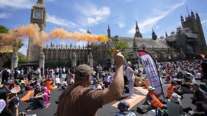 Protesters in UK decry climate change after record heatwave Protesters in UK decry climate change after record heatwave