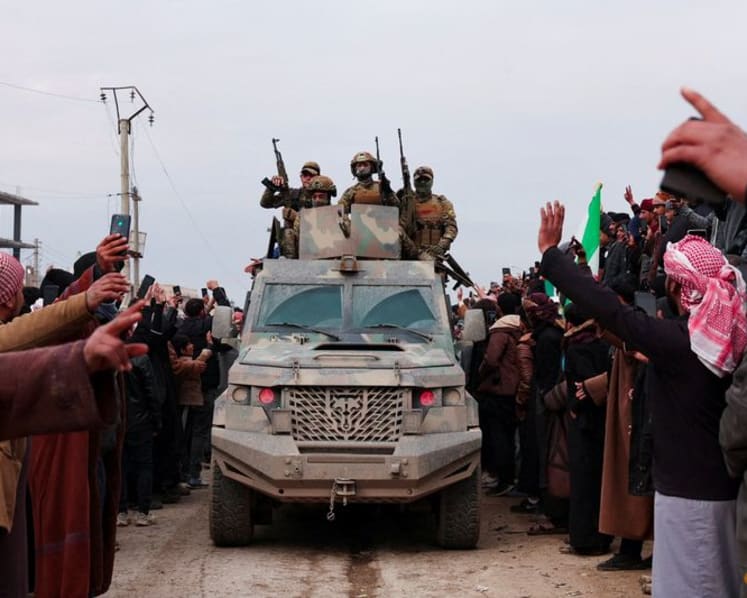 Syrian troops sweep northern towns as Kurdish fighters withdraw