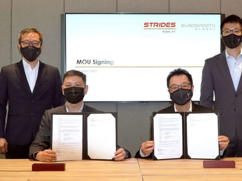SMRT Road Holdings president Tan Kian Heong and EuroSports Global chief executive officer Melvin Goh at the signing of a memorandum of understanding.