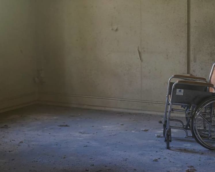 Nurse at old folks' home jailed for punching, kicking wheelchair-bound resident