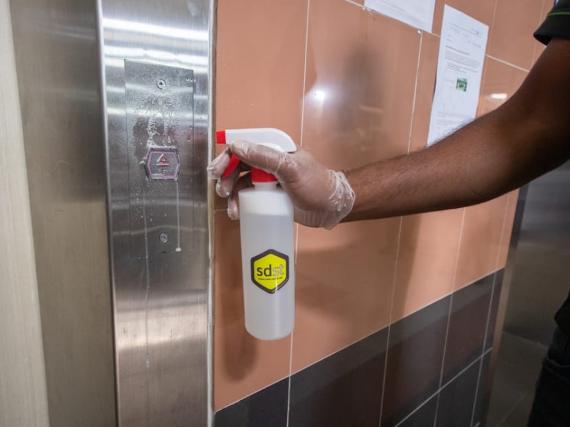 The disinfecting coating agent called "Sdst" being applied to lift buttons at public housing blocks. The disinfecting coating agent called "Sdst" being applied to lift buttons at public housing blocks.