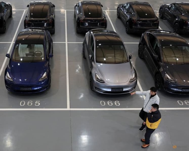 Millions of Teslas recalled in China over door handle safety