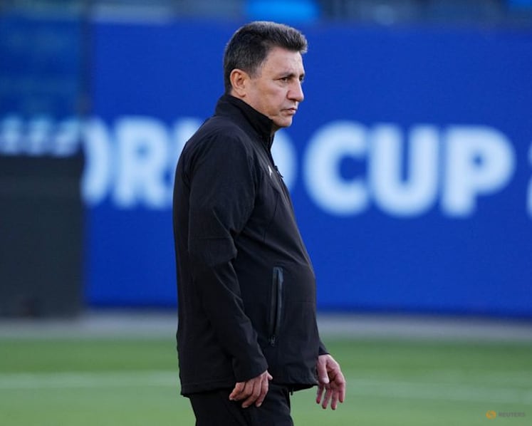 Iran's manager, striker pledge to play for all Iranians despite protests