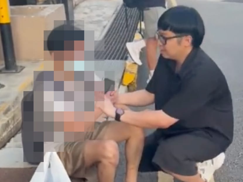 A screenshot from a video posted on TikTok by Mr Chai Wen Hao (right). The image of a man (left) who has been arrested by the police for voyeurism has been pixelated by TODAY for legal reasons.