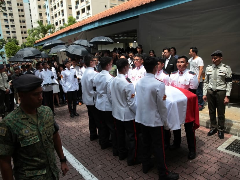 Relatives and friends of CFC Liu Kai watch as his coffin is carried into a waiting hearse bound for the Mandai Crematorium on Nov 6, 2018. Relatives and friends of CFC Liu Kai watch as his coffin is carried into a waiting hearse bound for the Mandai Crematorium on Nov 6, 2018.