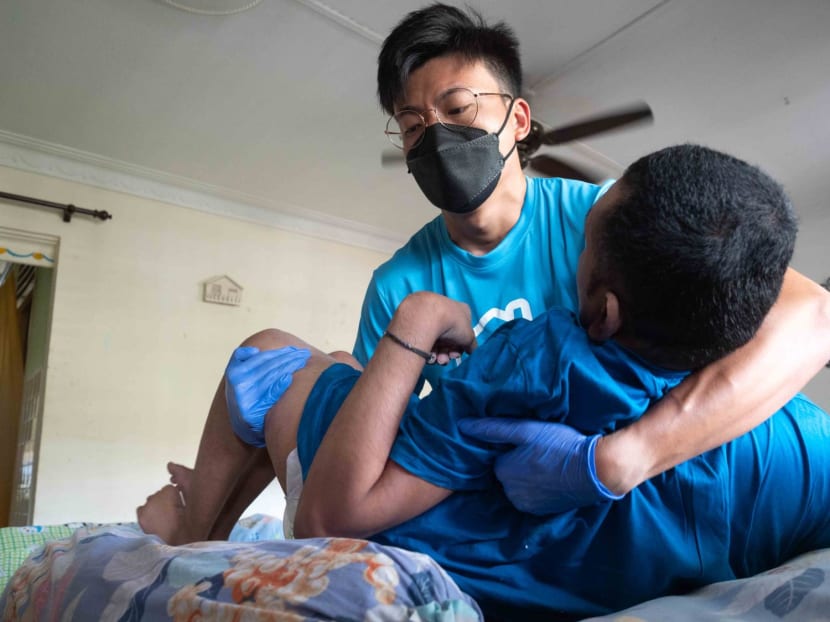 Mr Tan Wee Han attending to his patient. Mr Tan Wee Han attending to his patient.