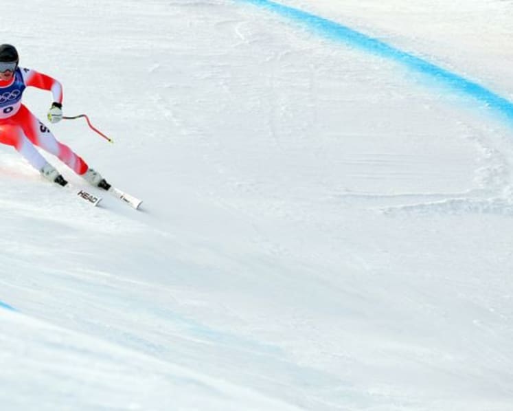 Alpine skiing-Von Allmen strikes gold again with more than a little help from his friend