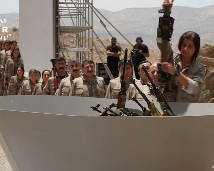 Kurdish PKK militants burn weapons in Iraq to launch disarmament