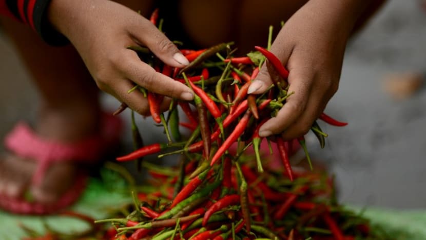 Maid jailed for stuffing chilli padi into girl's mouth, hitting her Maid jailed for stuffing chilli padi into girl's mouth, hitting her