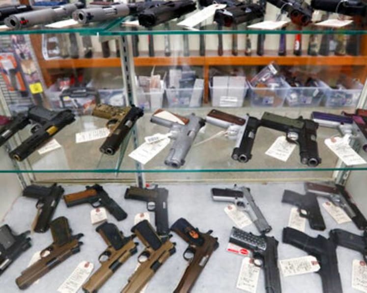 US background checks blocked a record high 300,000 gun sales