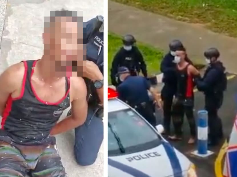 Screenshots from video footages showing the police arresting a man who was swinging a sword in the middle of Buangkok Crescent on March 14, 2022. Screenshots from video footages showing the police arresting a man who was swinging a sword in the middle of Buangkok Crescent on March 14, 2022.