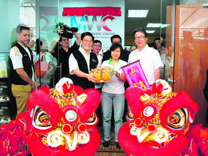 (From left) MWC Chairman Yeo Guat Kwang, NTUC President Diana Chia and NTUC Secretary-General Lim Swee Say at the opening of the Migrant Workers’ Centre’s new headquarters yesterday.  Photo: Don Wong