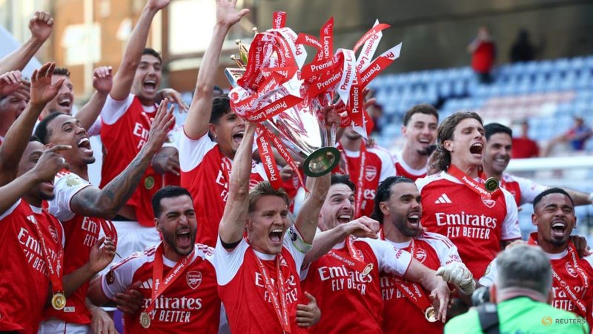 West Ham relegated, Arsenal lift Premier League trophy on emotional final day