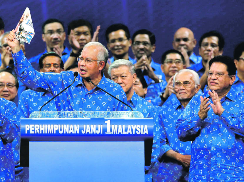 BN chief Najib Razak unveiling the coalition’s manifesto in Kuala Lumpur on Saturday. The manifesto promises tax breaks and cheaper cars, among other carrots. Photo: Reuters