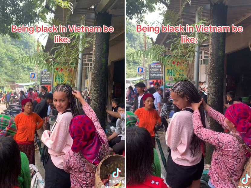 Screengrabs from a TikTok video by travel enthusiast Alana Rainer showing a woman in Vietnam curiously touching her braids. Screengrabs from a TikTok video by travel enthusiast Alana Rainer showing a woman in Vietnam curiously touching her braids.