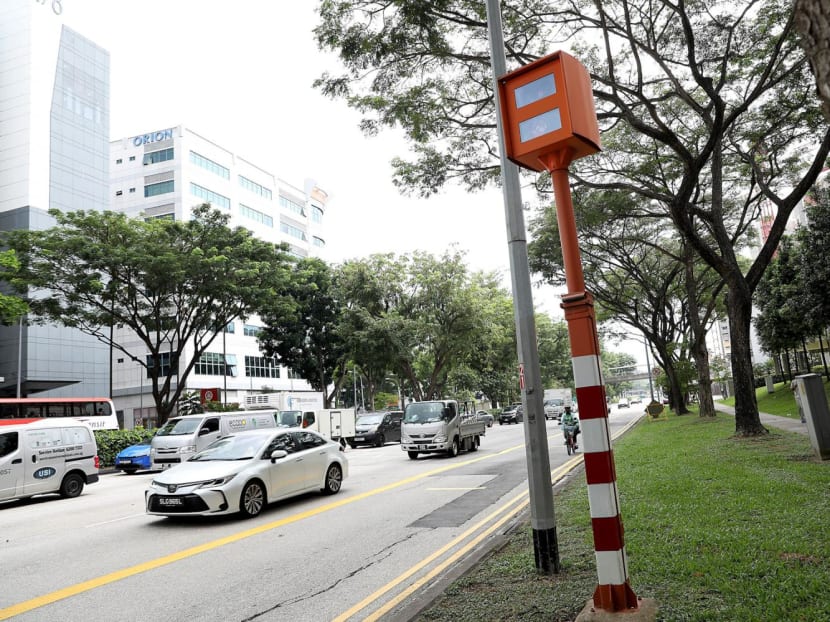 A red-light camera that can detect motorists beating red lights as well as speeding. A red-light camera that can detect motorists beating red lights as well as speeding.