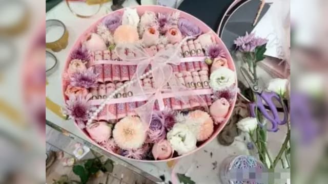 接大订单制作千元现金花束  中国一花店成洗钱帮凶