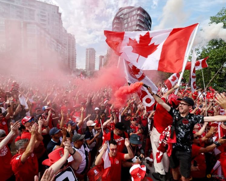 Canada fans on the march turn Vancouver into sea of red and white