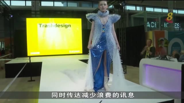 设计师用疫苗针筒 作成色彩缤纷服装