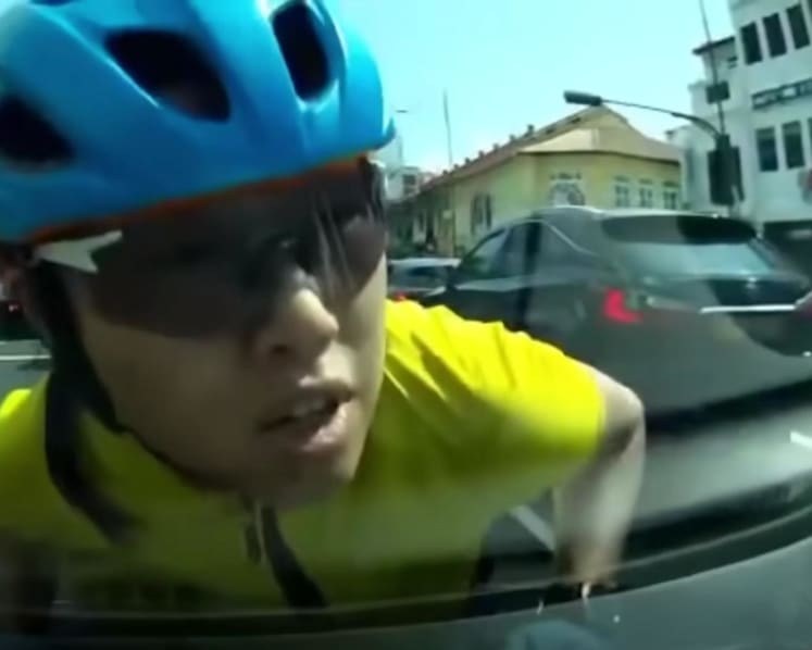 Cyclist who jumped onto car bonnet in Katong as vehicle drove off gets new harassment charge