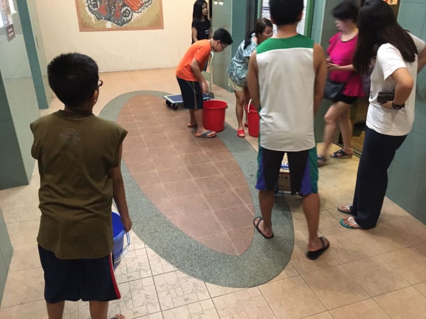 Water outage at Toa Payoh HDB block sees residents queue for water