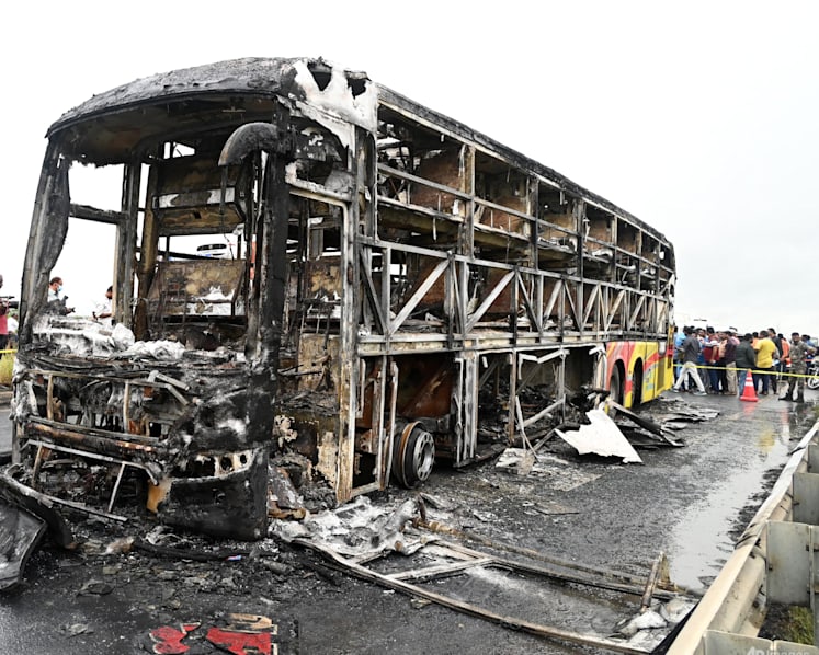 Bus catches fire after being hit by a motorcycle in southern India, killing at least 25