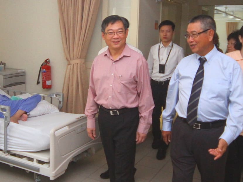Minister for Health Gan Kim Yong touring The Society for the Aged Sick's new tower block at its nursing home yesterday. Photo: Ernest Chua