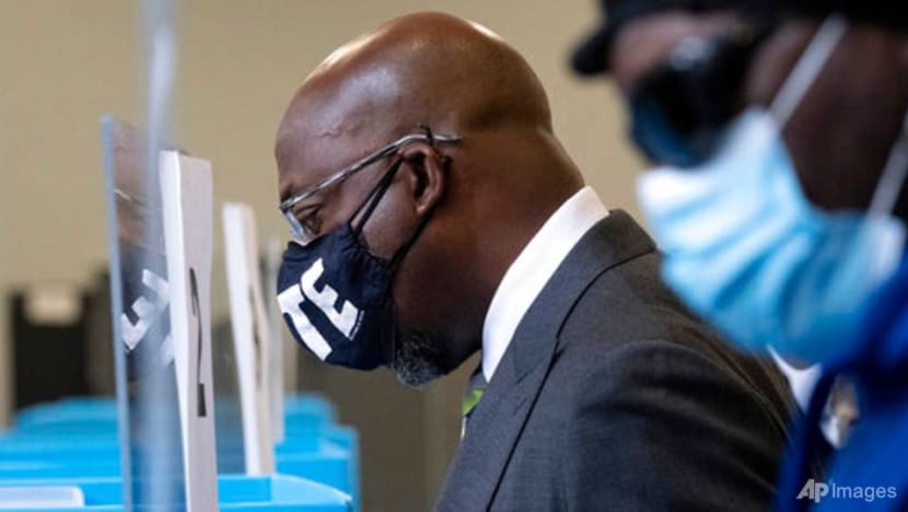 Warnock and Loeffler work to consolidate voters for runoff