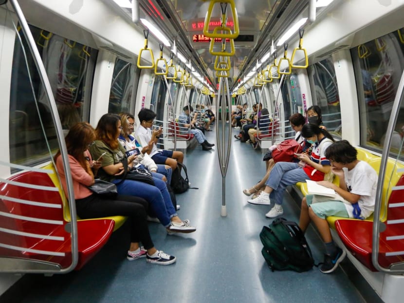 Commuters inside an MRT train on the Circle Line. Commuters inside an MRT train on the Circle Line.