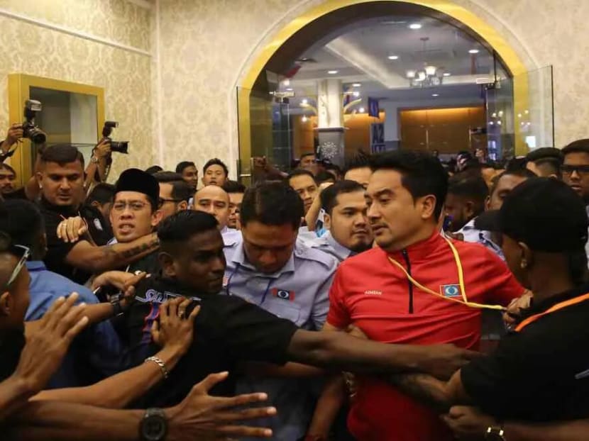 PKR Youth security personnel dressed in black were seen clashing with sacked permanent chairman Mizan Adli Md Noor and others who attempted to force their way into the Classic Ballroom of Melaka International Trade Center in Ayer Keroh. PKR Youth security personnel dressed in black were seen clashing with sacked permanent chairman Mizan Adli Md Noor and others who attempted to force their way into the Classic Ballroom of Melaka International Trade Center in Ayer Keroh.