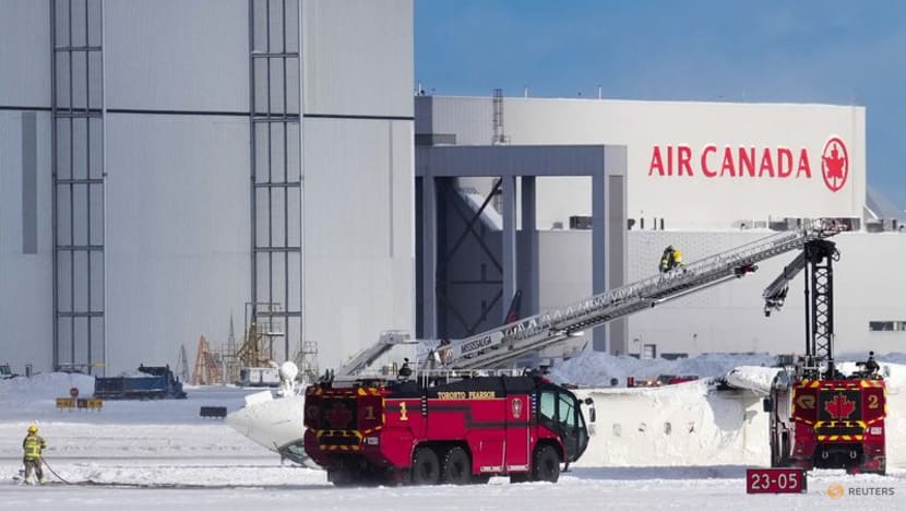 Delta plane flips on landing at Toronto airport, injuring 9 CNA