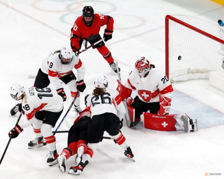 Ice hockey-Canada look to captain Poulin in title defence after goal-scoring record