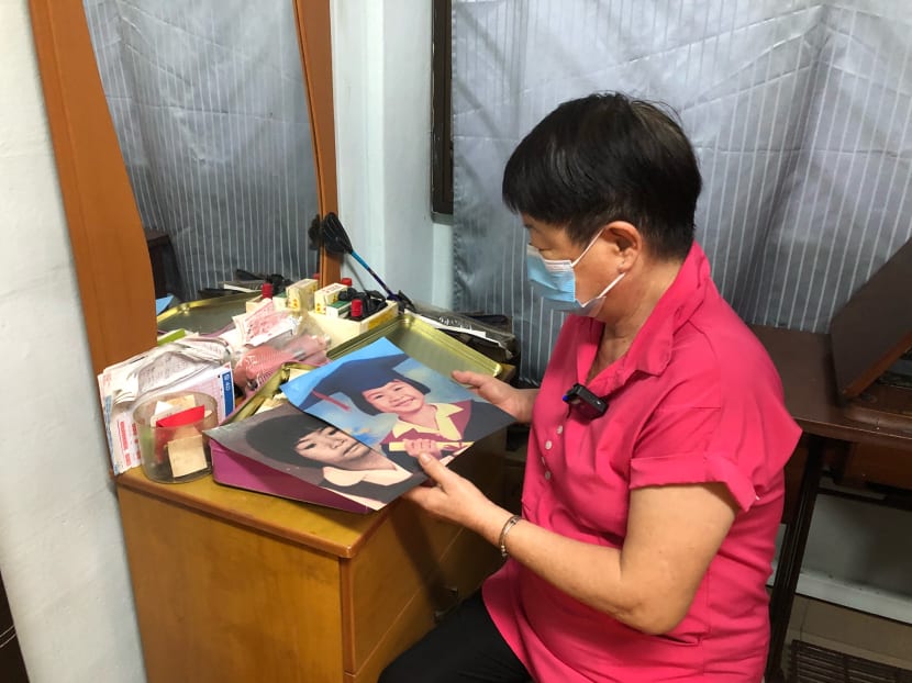 Madam Ang Goon Lay looking at pictures of her daughter Lim Shiow Rong, who went missing and is believed to be murdered in 1995 when she was seven years old. Madam Ang Goon Lay looking at pictures of her daughter Lim Shiow Rong, who went missing and is believed to be murdered in 1995 when she was seven years old.