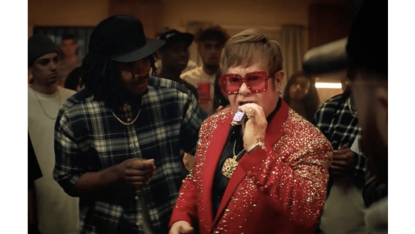 Sir Elton John takes on rap battle for Snickers ad
