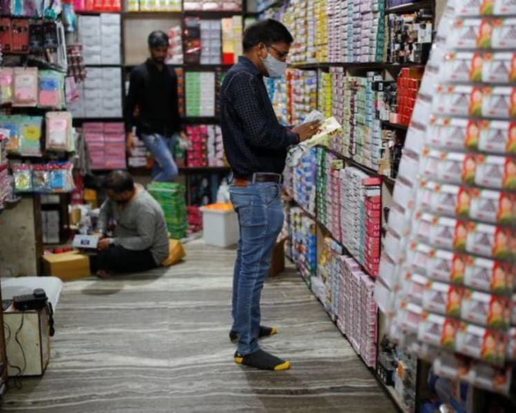 India's daily COVID-19 cases dip below 100,000 for first time in 2 months