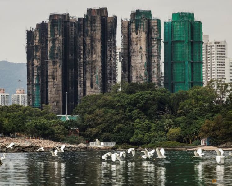 Hong Kong plans to buy homes devastated in deadly high-rise fire