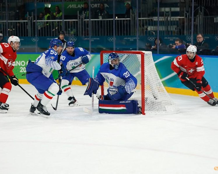 Ice hockey-Swiss ease past Italy to set up quarter-final with Finland