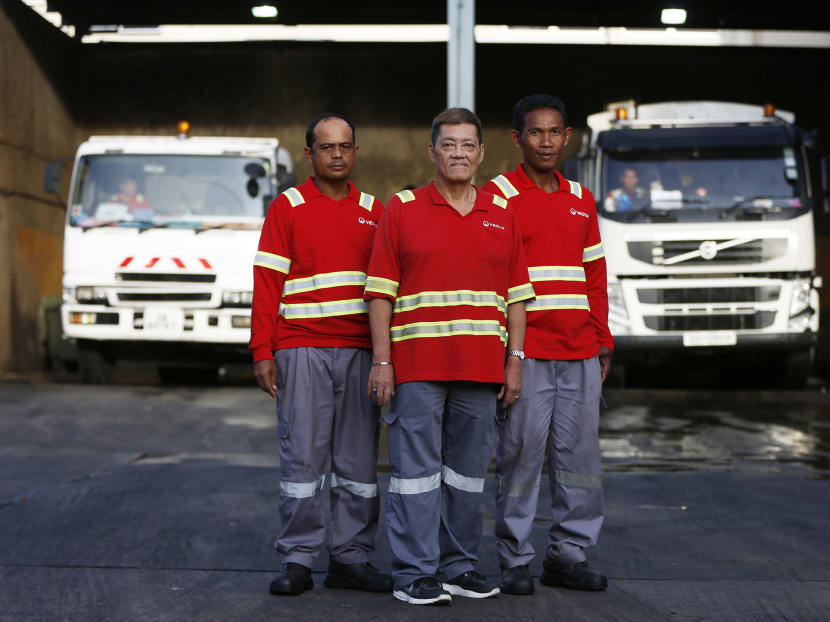 From left to right, Mr Amran Chedaud, Mr Tan Beng Hoe and Mr Jumahat Yusuf. The team is in charge of collecting recyclables daily from the homes in Clementi. Photo: Raj Nadarajan/TODAY